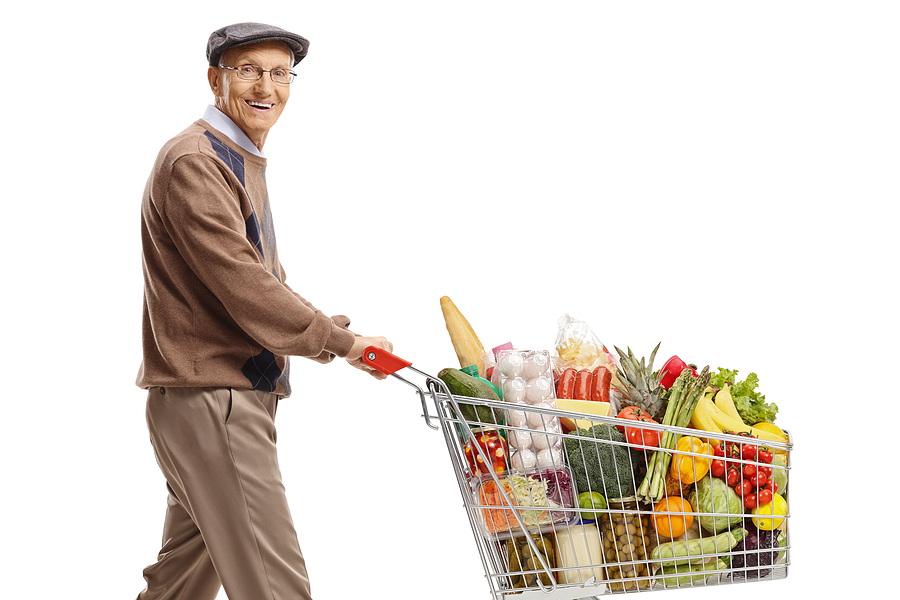 Senior man pushing a shopping cart